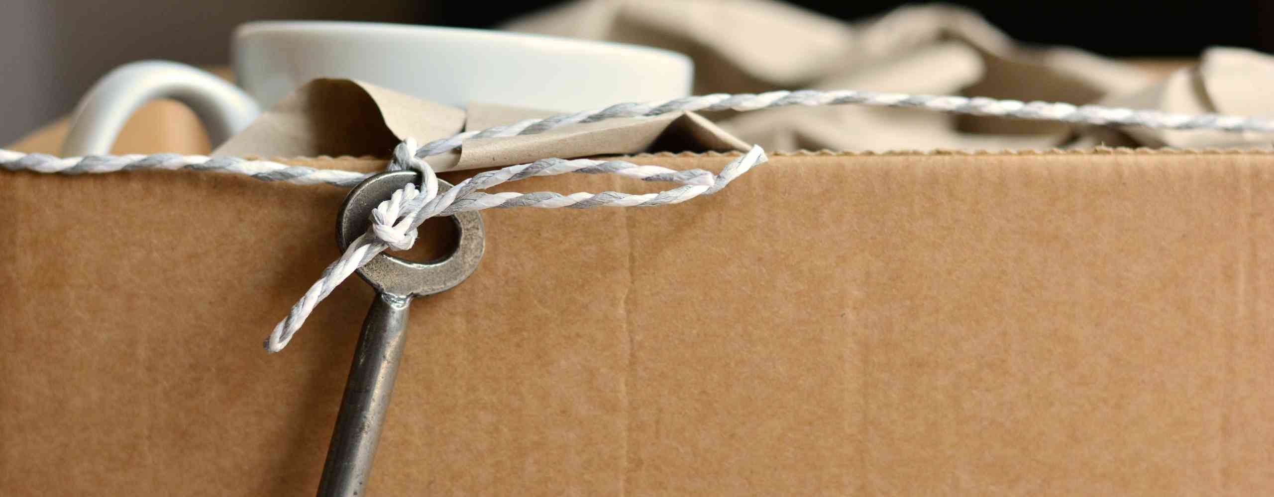 Moving house packing box and key